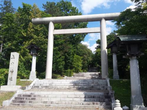 Japanese gate known as a Torii (鳥居). Traditionally found at the entrance to a Shinto shrine, marking the transition into sacred land.